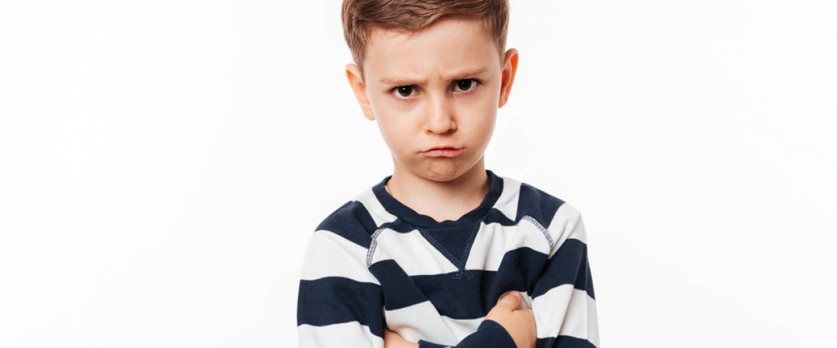 boy angry arms crossed