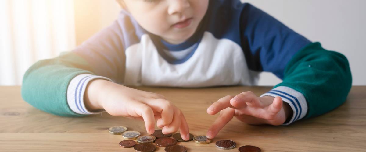 Young child counting coins
