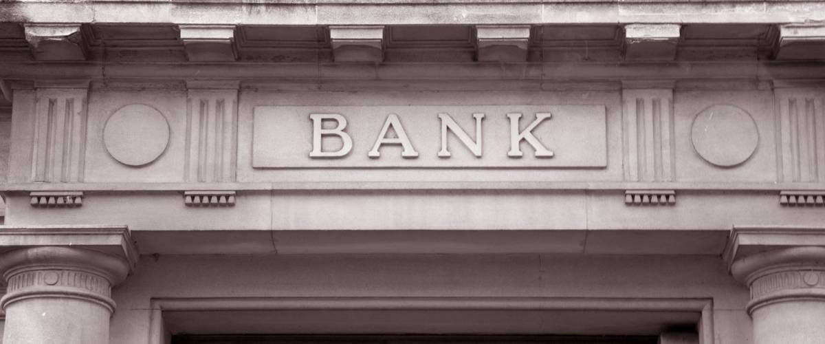 Bank Sign over Entrance Door in Black and White Sepia Tone