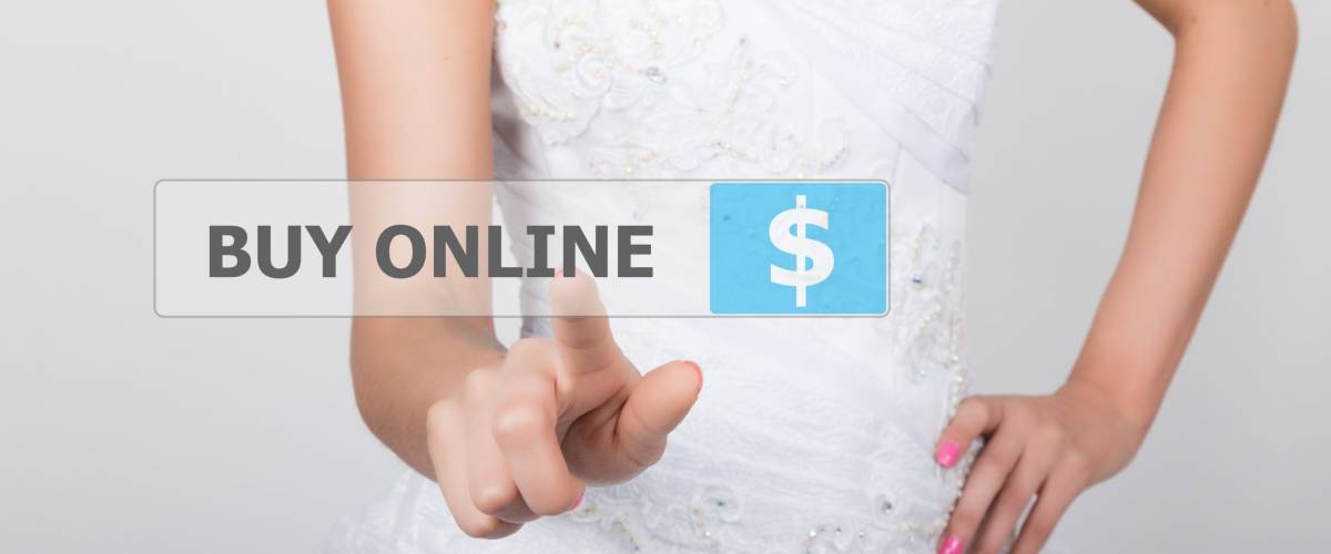 technology, internet and networking concept. Beautiful bride in fashion wedding dress. Bride presses buy online button on virtual screens