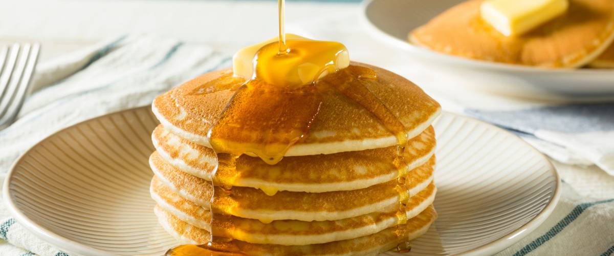 Sweet Homemade Stack of Pancakes with Butter and Syrup for Breakfast