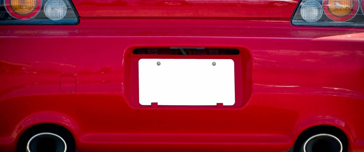 Blank License Plate On Red Car