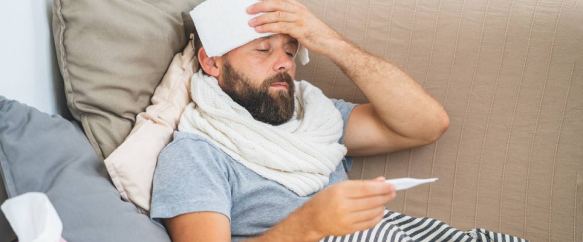 man sick in bed