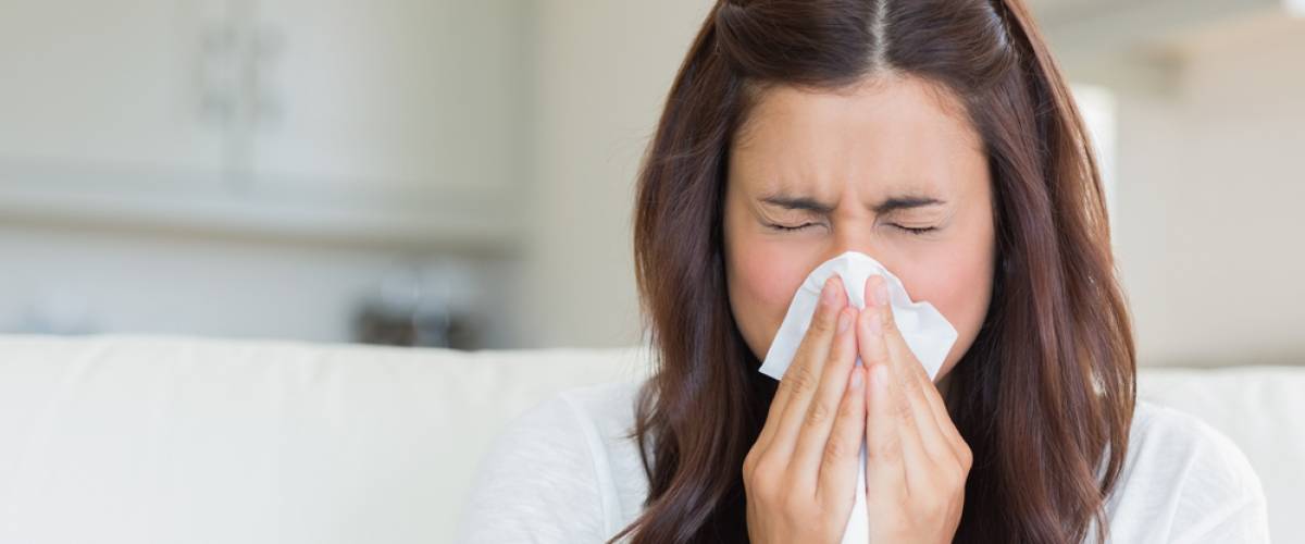 woman sneeze