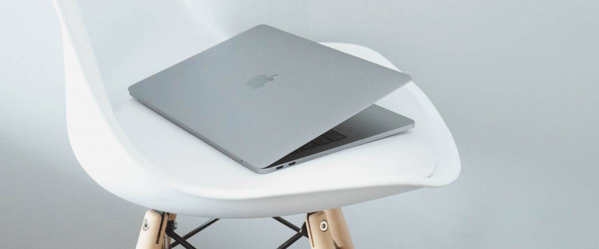 macbook on a chair