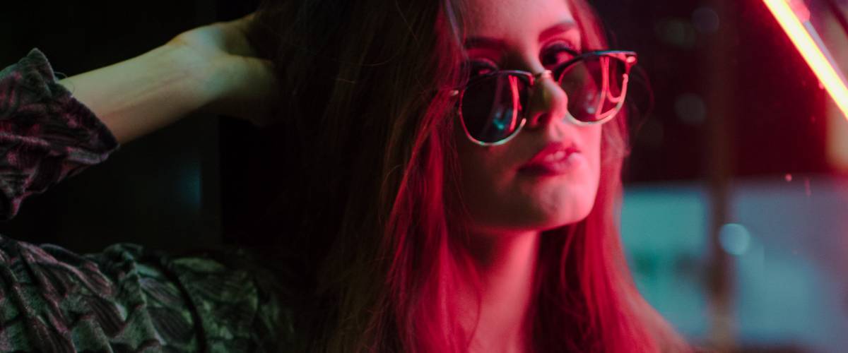 stylish young woman neon lights night