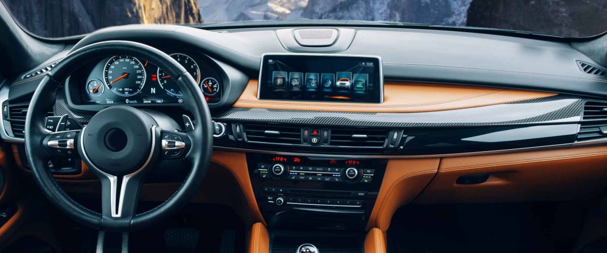Modern suv car interior with leather panel, multimedia and dashboard