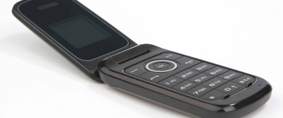 Flip cell mobile cell phone on white background