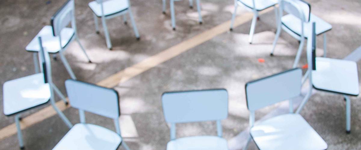 Defocused image of empty chairs. Musical chairs. (Blurred focus)