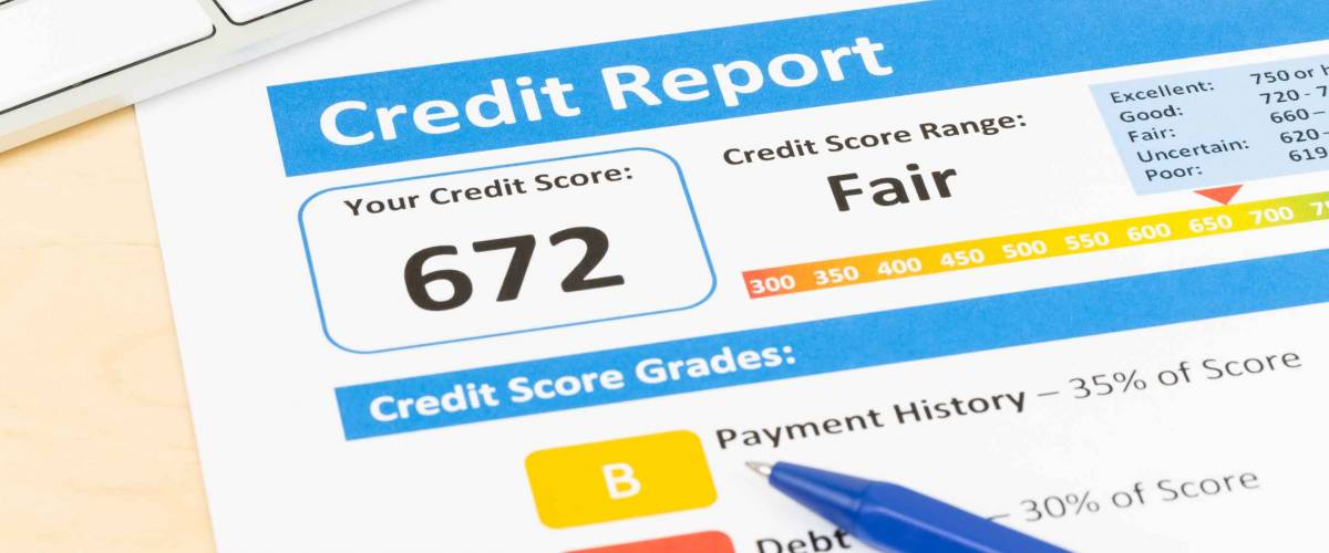 Fair credit score report with pen and keyboard