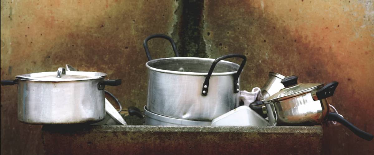 Dirty pots and pans in sink