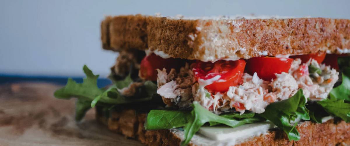 Tuna sandwich on a wooden board