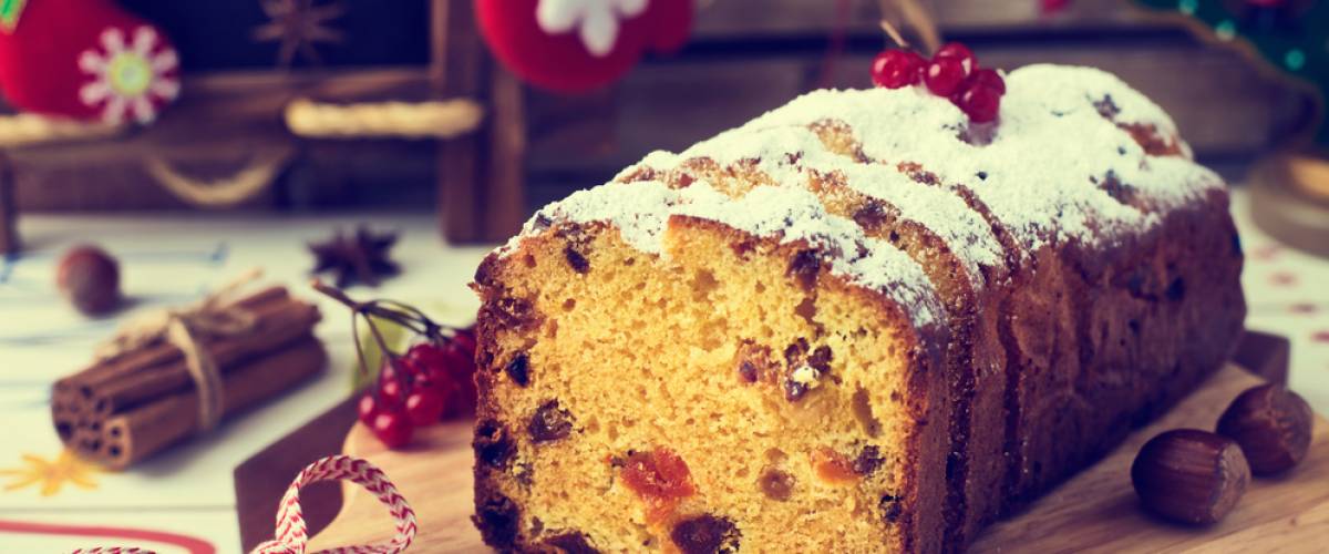 Fruitcake sitting on wooden tray