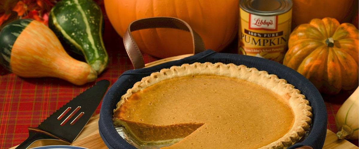 Pumpkin pie with can of pumpkin pie mix