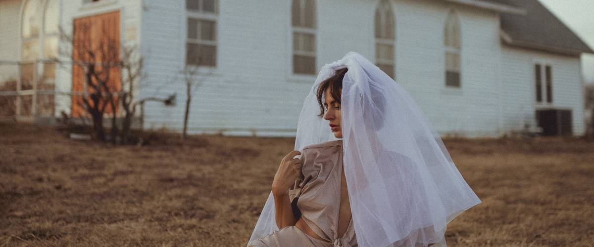 Bride posing on the ground