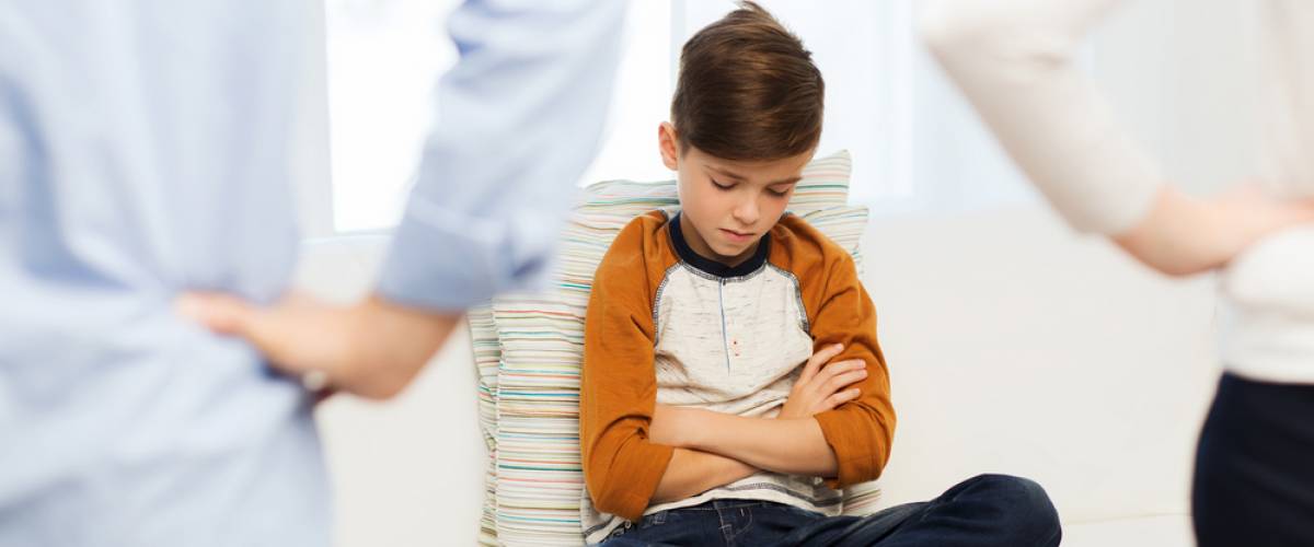 Unhappy boy with parents