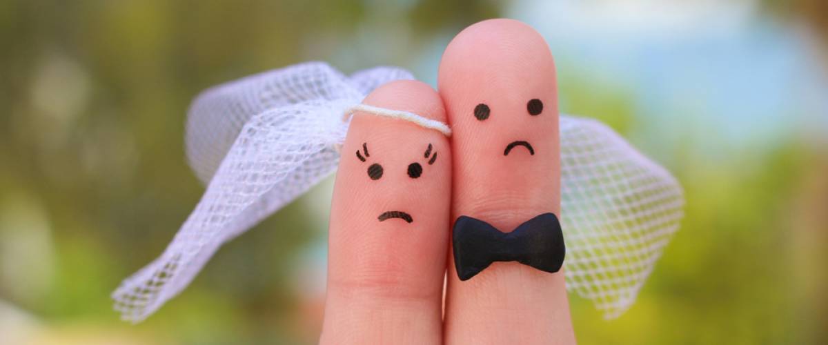 Fingers of unhappy married couple