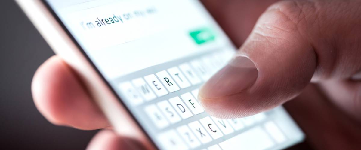 Man texting on smartphone