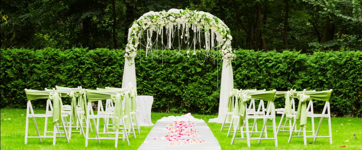 Wedding arch and chairs in park