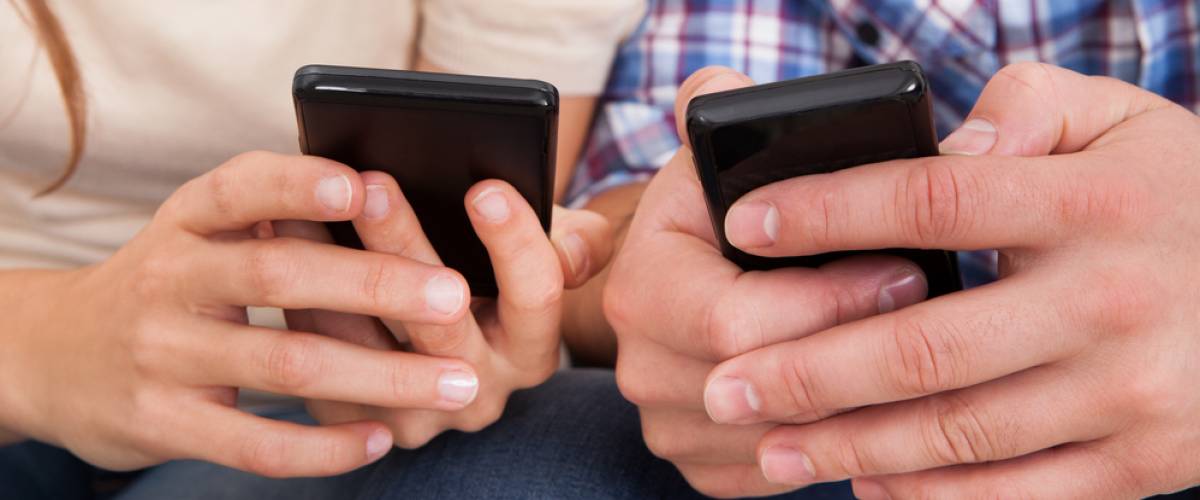 Couple texting on their phones