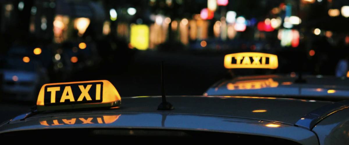Taxi signs on cars