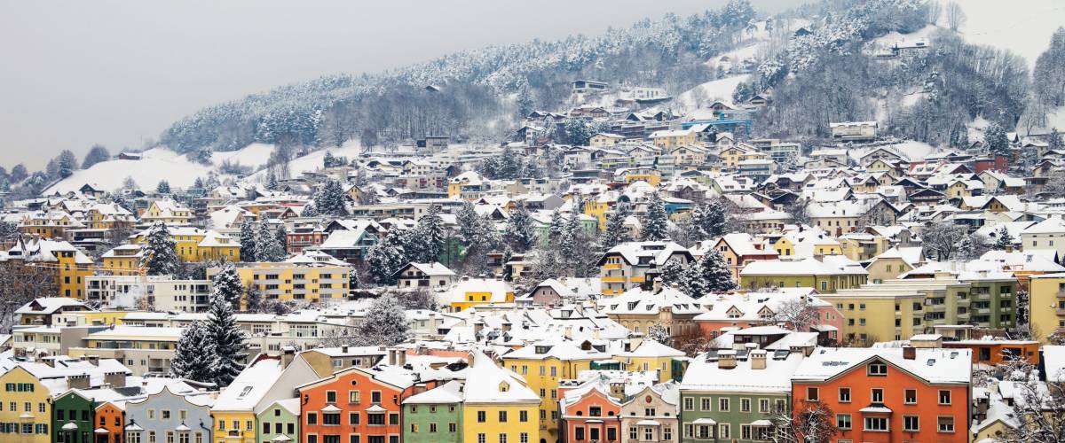 Innsbruck, Austria. Aerial view of Innsbruck, Austria during the winter morning, with snow and mountains at the background.