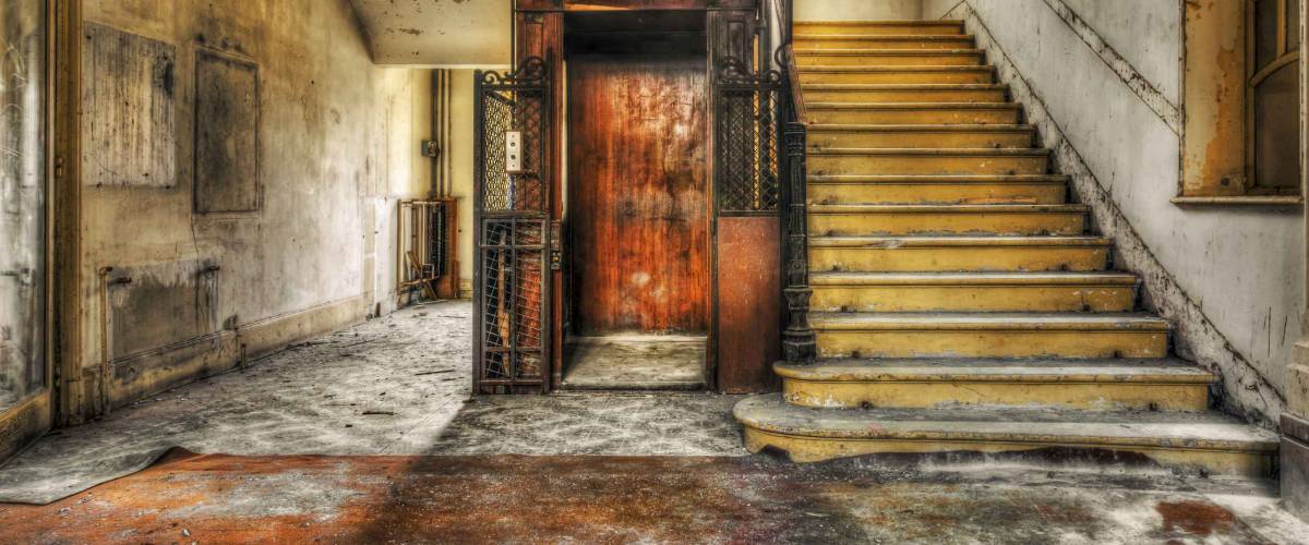 Old vintage lift at abandoned hotel lobby, HDR processing