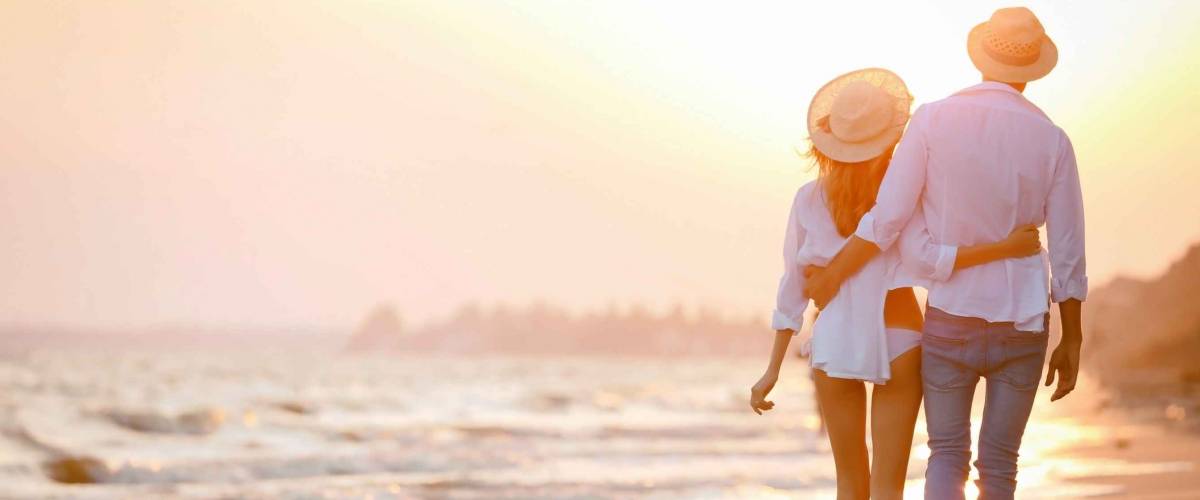 Young happy couple on seashore