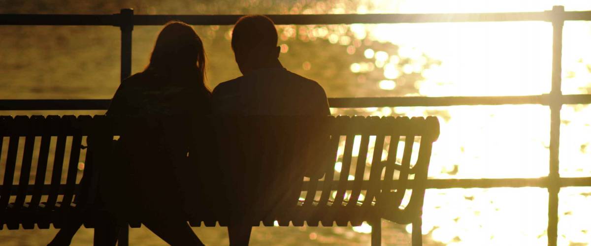 Couple on Bench in front of Mississippi River