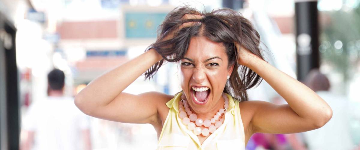 crazy young girl shouting in a shopping center