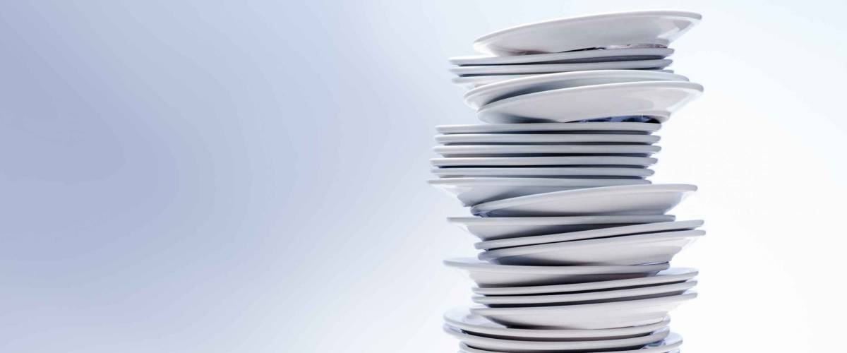 High stack of plates, isolated on white