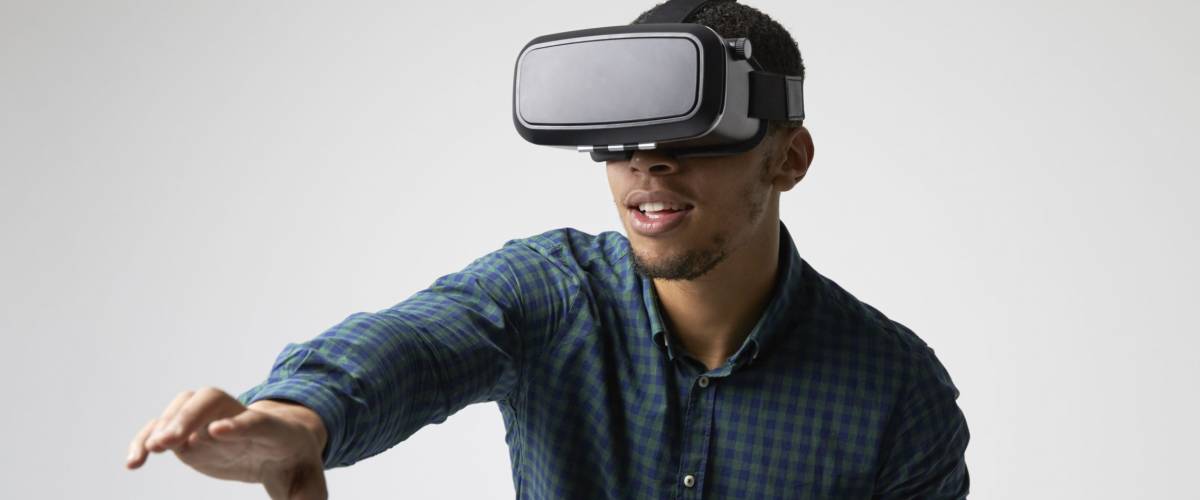 Studio Portrait Of Video Game Designer Wearing VR Headset