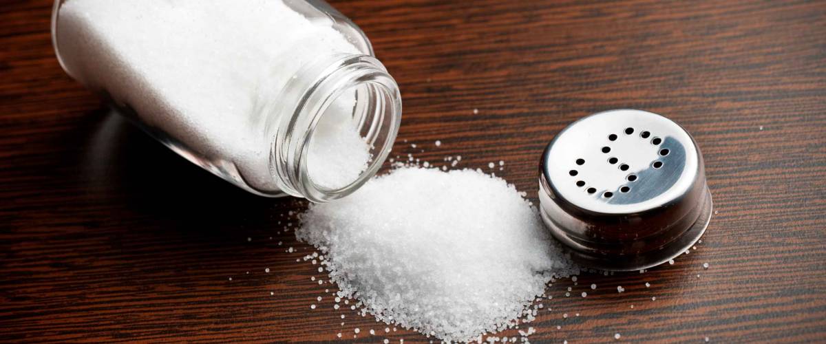 salt sprinkled on wooden table