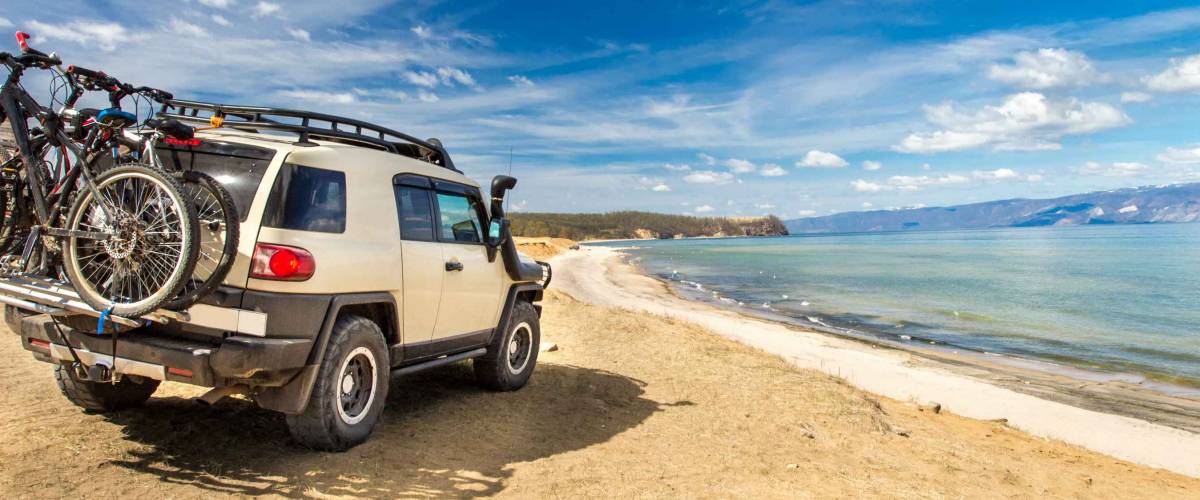 Off-road car on the sea coast