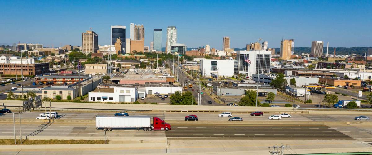 Cars and trucks traverse the urban jungle and maze of highway around downtown Birmingham Alabama