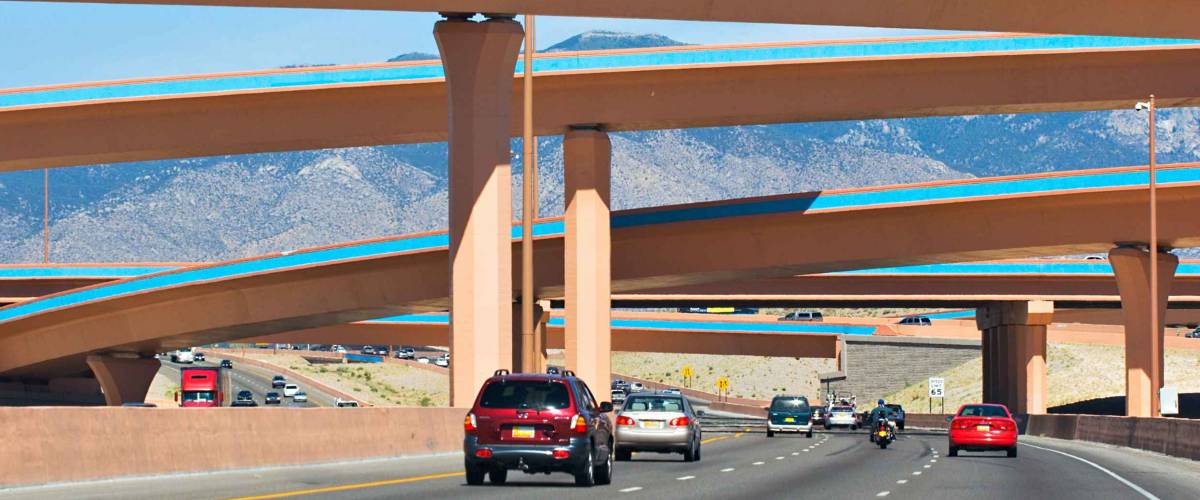 A driving view of colorful overpasses along I-40, near Albuquerque.