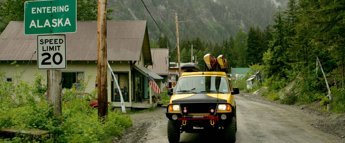Yellow van on street of Hyder, Alaska