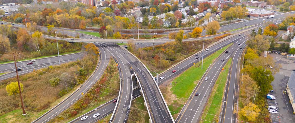 Fall color fills the tress around the urban landscape of East Hartford Connecticut in New England