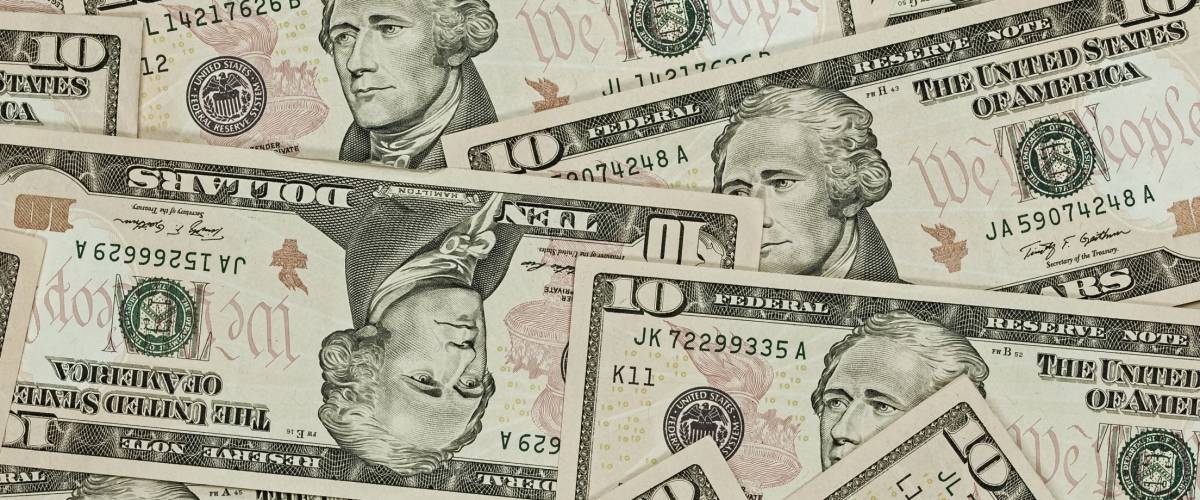 A Pile of Ten Dollar Bills as a Money Background