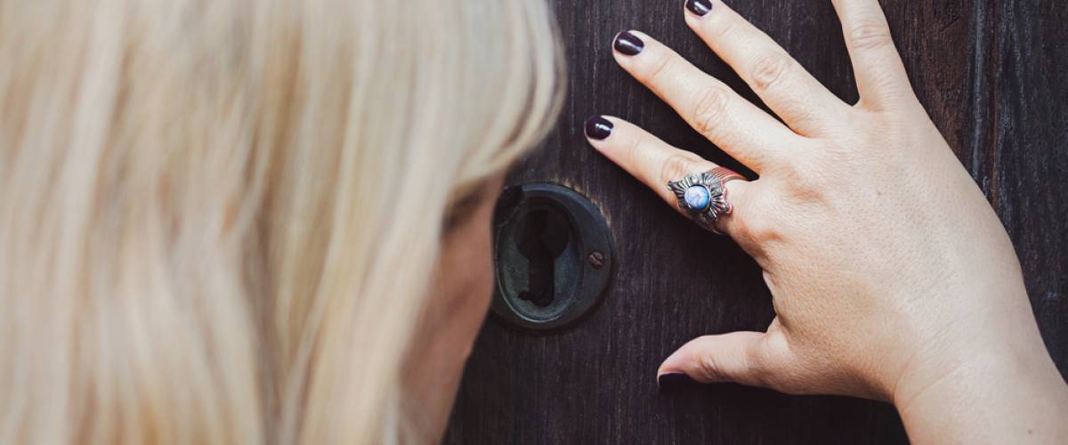 woman keyhole spying