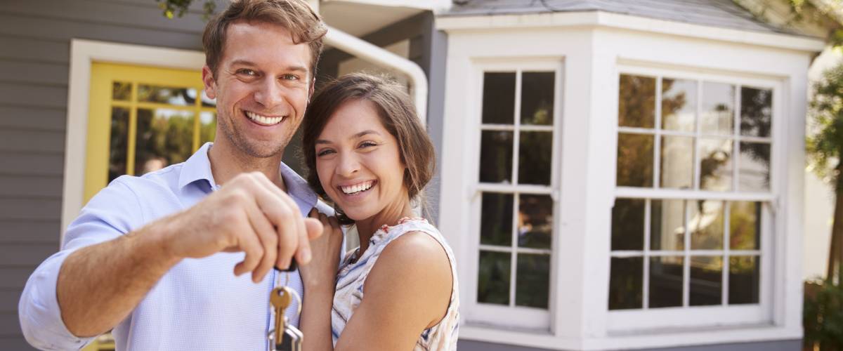 Couple with house keys