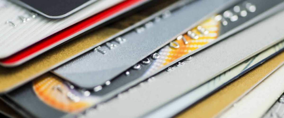 Stack of multicolored credit cards close-up
