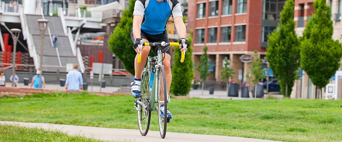 Mature cyclist in city park