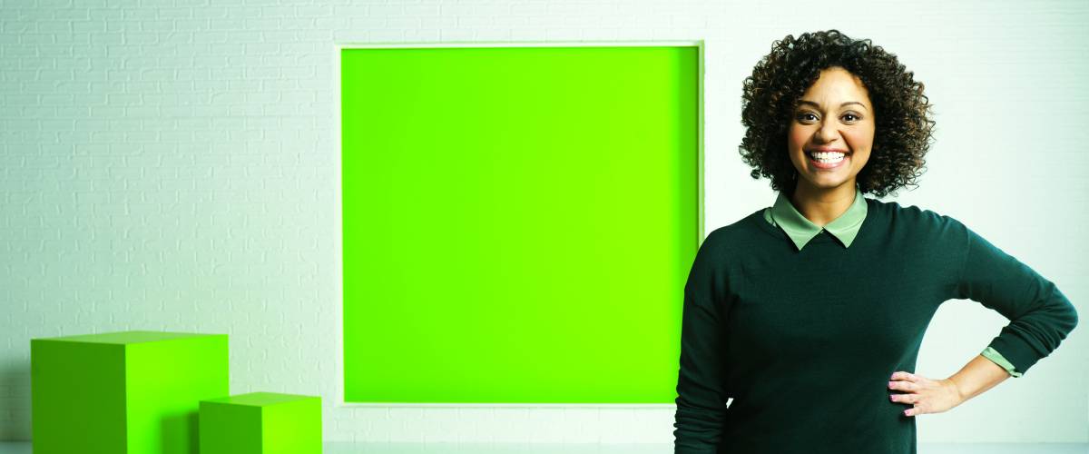 Woman posing with H&R Block logo