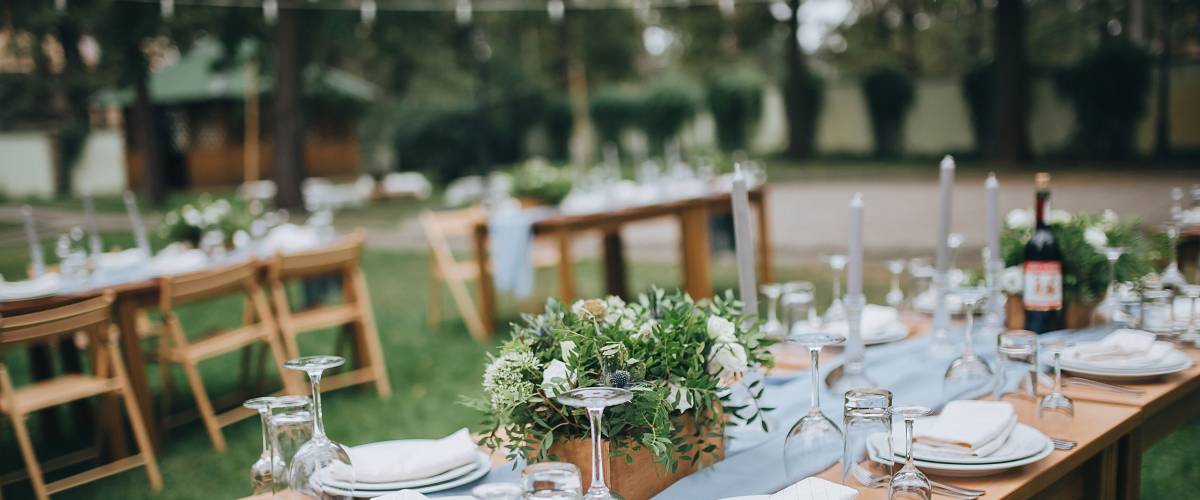 Wedding. Banquet. The chairs and table for guests, decorated with candles.
