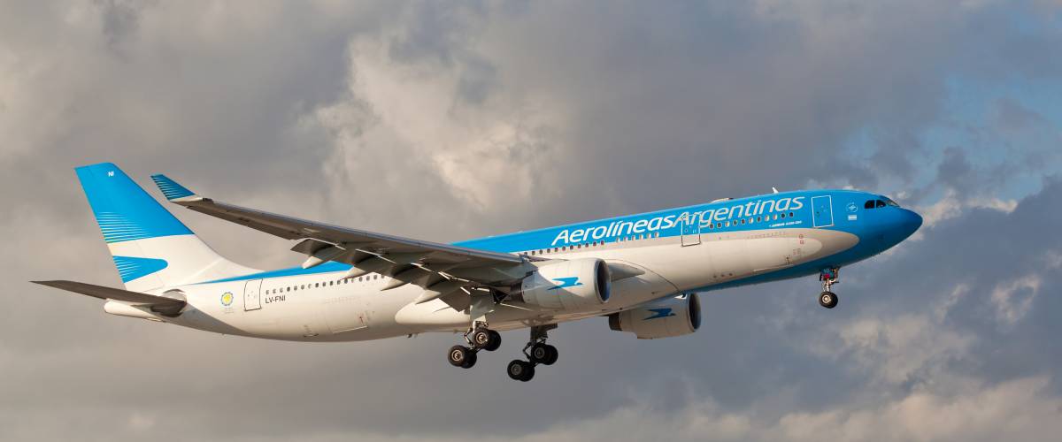 Aerolineas Argentinas airplane flying in the air.