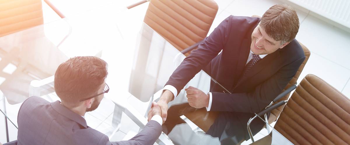 Broker and lender shaking hands