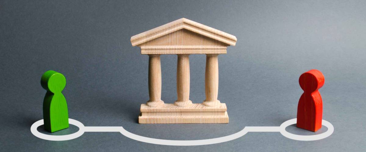 Two figures of people bypassing the bank.