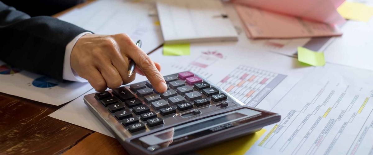 Bookkeeper or financial inspector hands making report, calculating. Home finances, investment, economy, saving money or insurance concept
