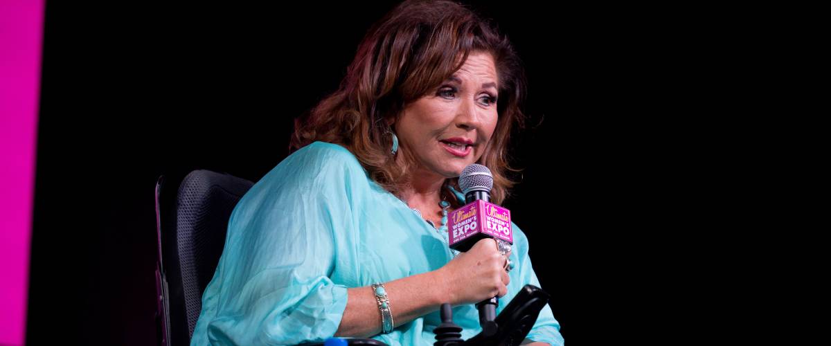 Abby Lee Miller speaks on stage during the 2022 Ultimate Women's Expo Houston